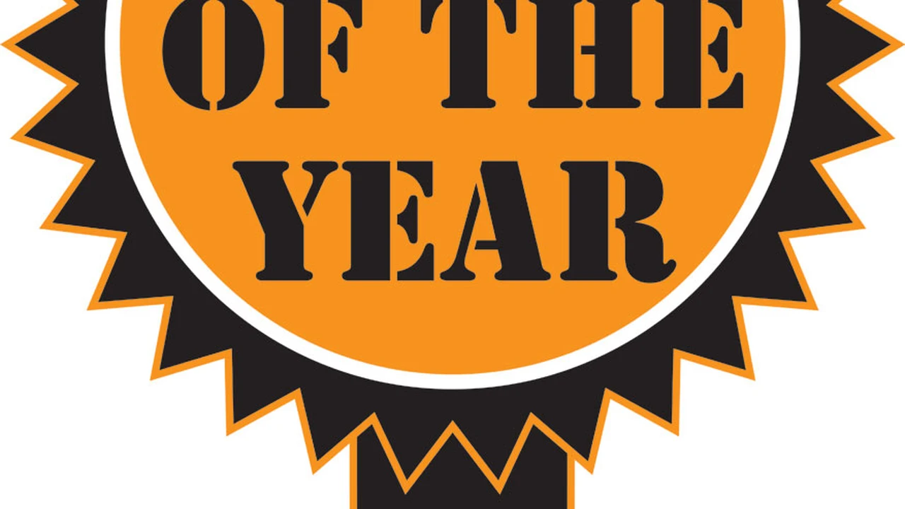 blue bowl of black bean beef tortilla soup on a board with cilantro and shredded cheese in background