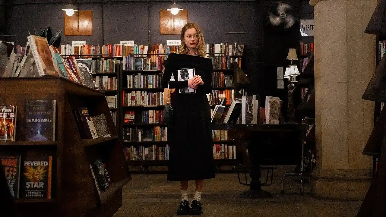 Close up on a plate of mashed potatoes, topped with baked pork chops with cream of mushroom soup, and a side of green beans.